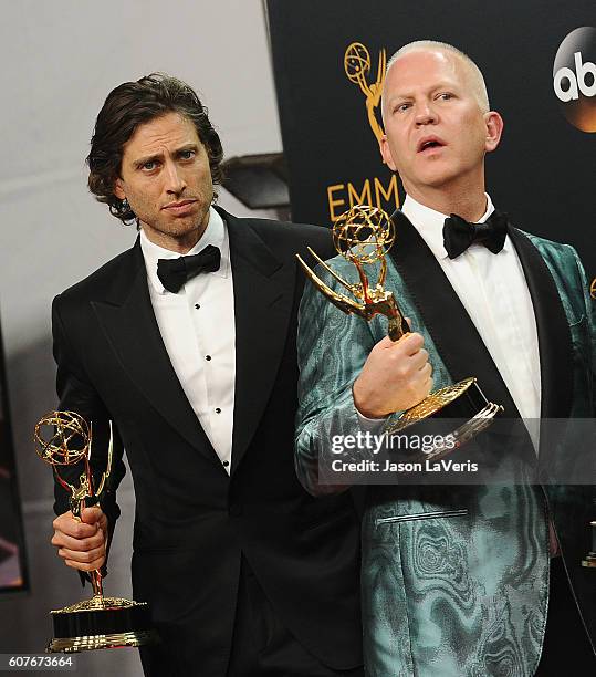 Producers Brad Falchuk and Ryan Murphy pose in the press room at the 68th annual Primetime Emmy Awards at Microsoft Theater on September 18, 2016 in...