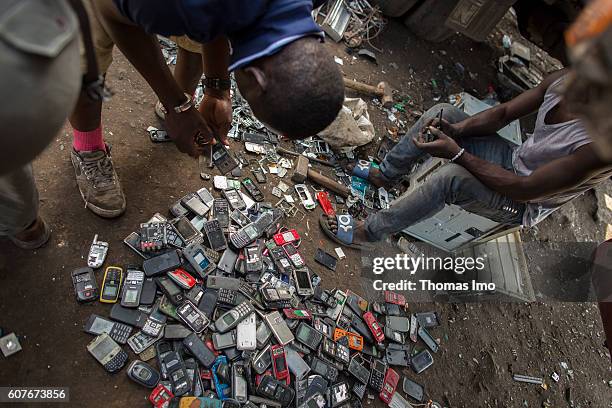 Accra, Ghana Young Africans disassemble old mobile phones on the largest electronic scrap yard of Africa in Agbogbloshie, a district of Ghana's...