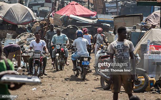 Accra, Ghana Young Africans are riding motorcycles on the biggest electronic scrap yard in Agbogbloshie, a district in Ghana's capital on September...