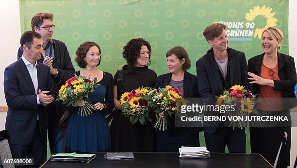 The Greens' co-leaders Cem Oezdemir and Simone Peter congratulate the party's candidates for a regional election Daniel Wesener, Antje Kapek, Bettina...