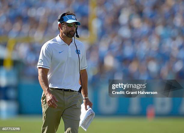 Head coach Larry Fedora of the North Carolina Tar Heels watches his team play against the James Madison Dukes during the game at Kenan Stadium on...