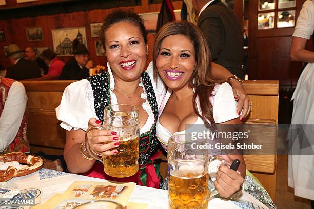Patricia Blanco and her sister Mercedes Blanco pose during the Oktoberfest at Augustiner-Braeu /Theresienwiese on September 19, 2016 in Munich,...