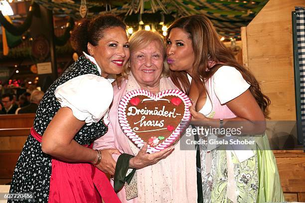 Patricia Blanco, her mother Mireille Blanco and her sister Mercedes Blanco pose during the Oktoberfest at Augustiner-Braeu at Theresienwiese on...