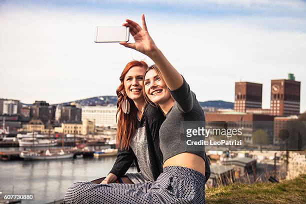 women hanging out in the city during spring - norway city stock pictures, royalty-free photos & images
