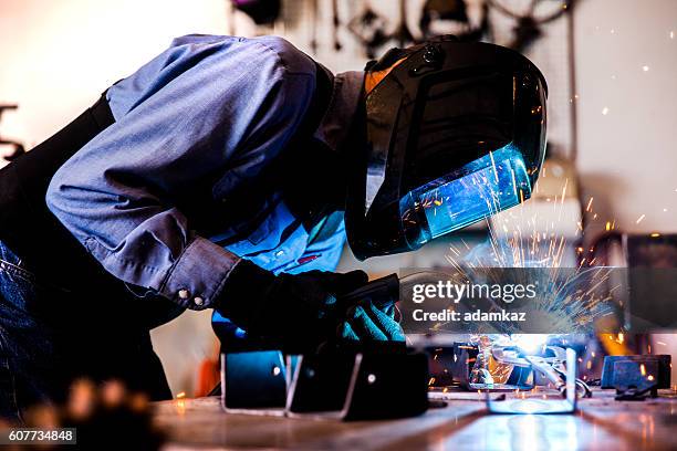 senior man welding in workshop - in flames i the mask stock pictures, royalty-free photos & images