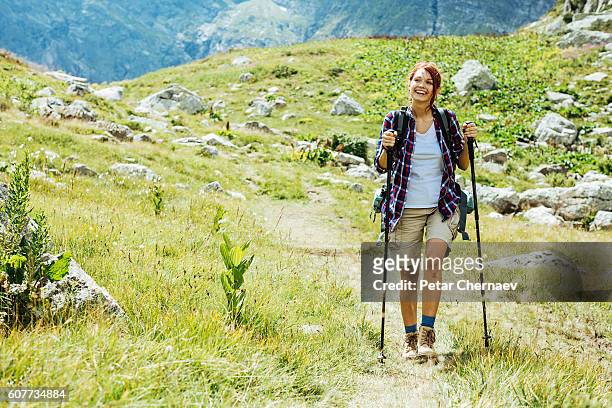 happy on the mountain footpath - nordic walking stock pictures, royalty-free photos & images