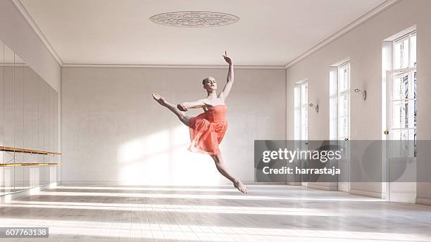 ballerina at ballet class - arabesque stockfoto's en -beelden