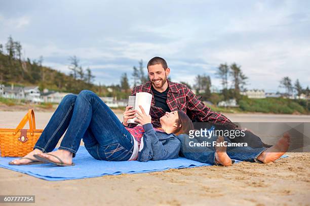 cute young hetersexual family relaxing at the beach - fat guy running bildbanksfoton och bilder