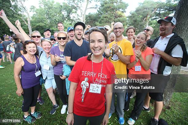 Erica Emerson cancer survivor poses for pictures with her friends at the Terry Fox run at High Park.
