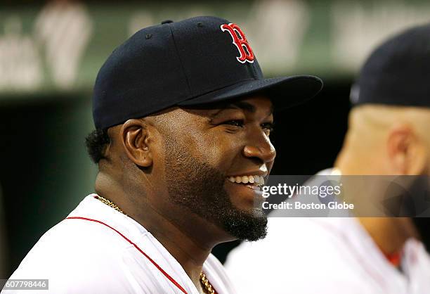 Boston Red Sox player David Ortiz laughs in the dugout before the start of the first inning against the New York Yankees at Fenway Park in Boston on...