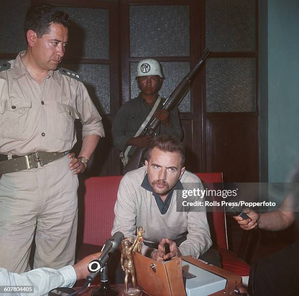 French journalist and writer, Regis Debray pictured at a press conference inside the military club in Camiri, Bolivia on 14th August 1968 after being...