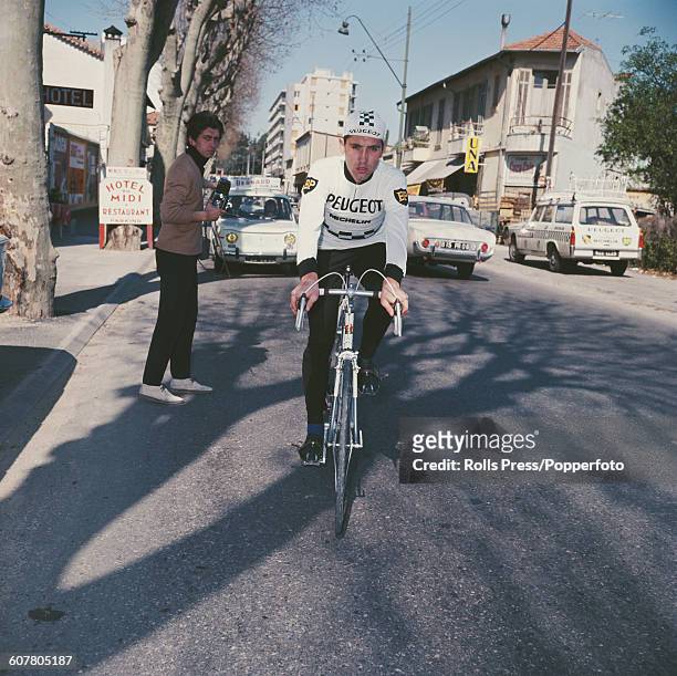 Belgian racing cyclist Eddy Merckx pictured wearing a Peugeot - BP - Michelin team jersey whilst riding a race bike in France in 1968.