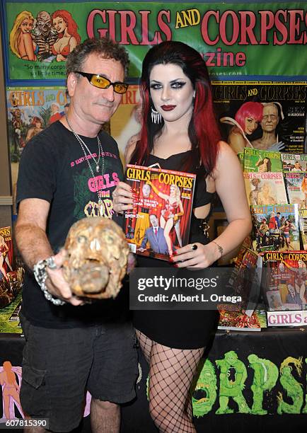 Publisher Robert Steven Rhine and model/actress Sasha Baxter attends Son Of Monsterpalooza held at Los Angeles Marriott Burbank Airport on September...
