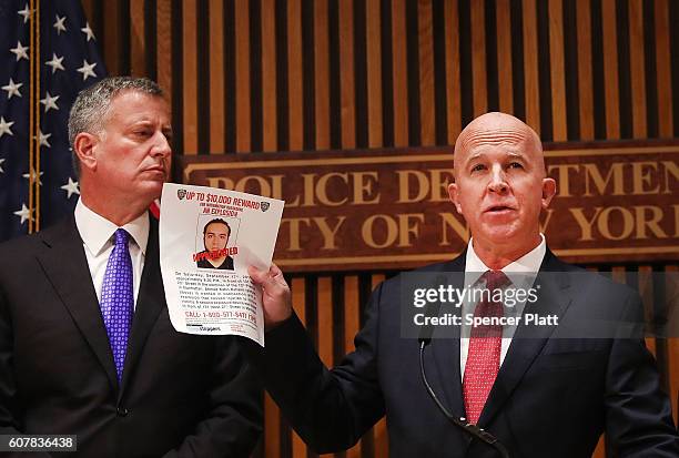 New York City police commissioner James O'Neill stands with Mayor Bill de Blasio as he holds up a picture of Ahmad Khan Rahami, the man believed to...