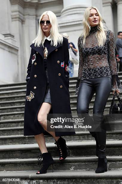 Poppy Delevingne and Jessica Hart attend the Christopher Kane show at Tate Britain during London Fashion week on September 19, 2016 in London,...