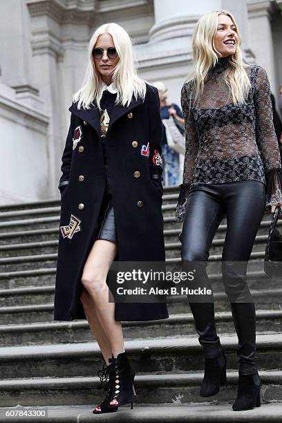 Poppy Delevingne and Jessica Hart attend the Christopher Kane show at Tate Britain during London Fashion week on September 19, 2016 in London,...