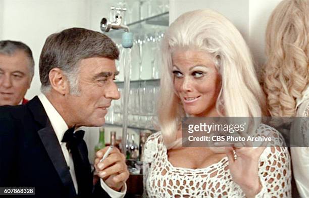 Theatrical movie originally released May 28, 1969. Film directed by Stuart Rosenberg. Pictured left to right, Peter Lawford , and Dee Gardner . Frame...