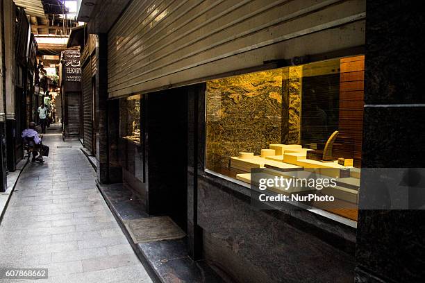 An Egyptian vendor waits for customers in his shop in Khan Al-Khalili market in Cairo, Egypt,on September 19, 2016. Shops are not working because of...