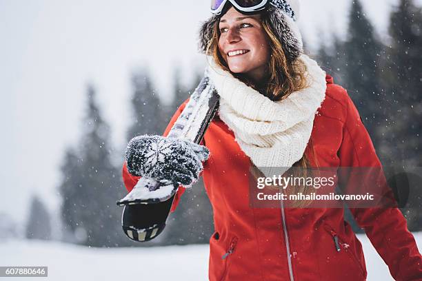 smiling skier enjoying the winter time - ski jacket stock pictures, royalty-free photos & images