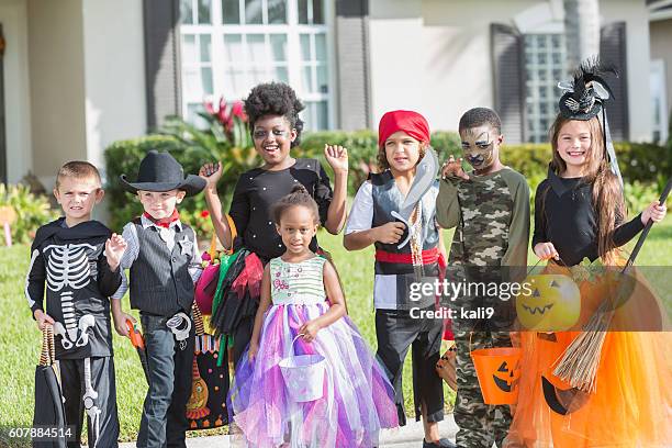 multi-ethnic group of children in halloween costumes - princess pirates stock pictures, royalty-free photos & images