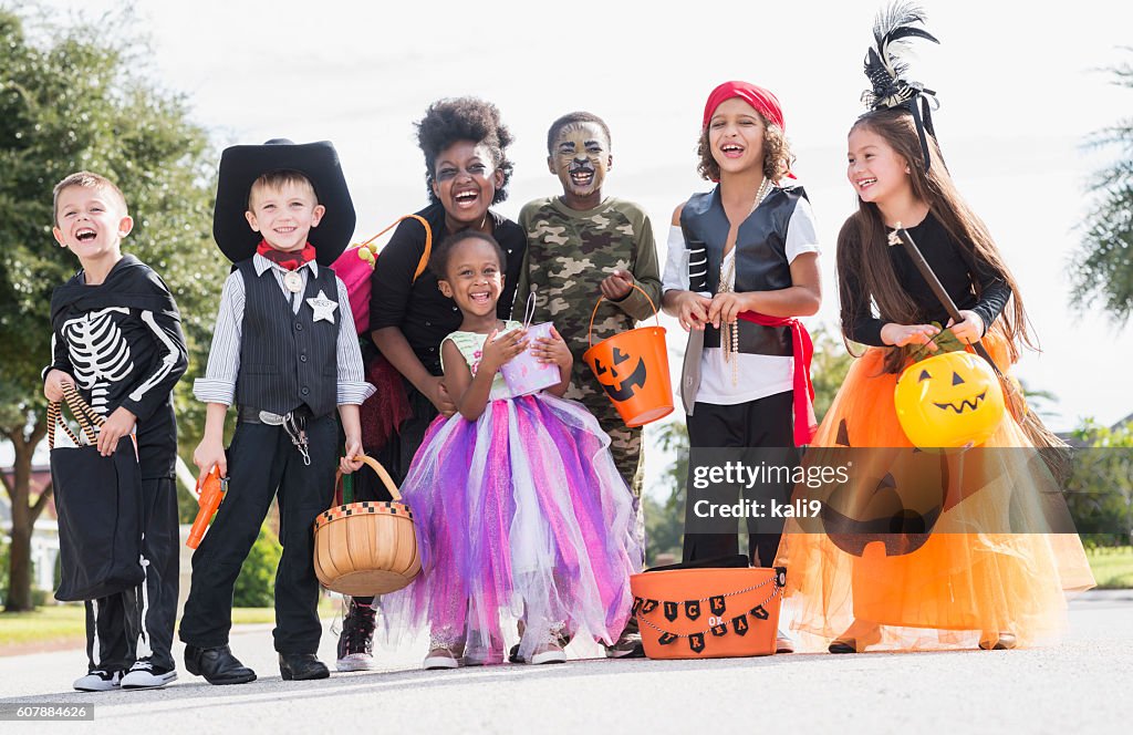 Multi-ethnic group of children in halloween costumes