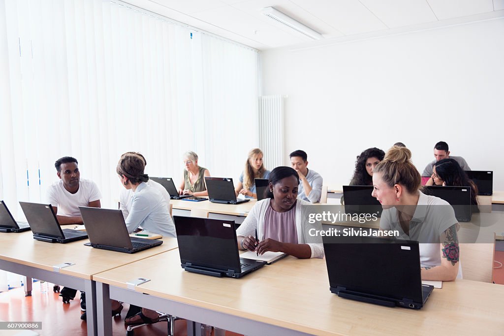 Training Class Picture Training Class Students Learning At Pc Discussion High-Res Stock Photo ...