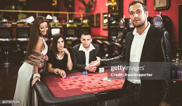 casino friends in las vegas - las vegas casino interior stock pictures, royalty-free photos & images