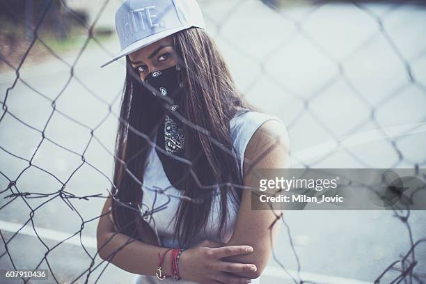 rebellious mood - female gangster stock pictures, royalty-free photos & images