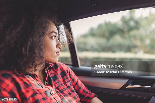 young woman traveling - sad commuter stockfoto's en -beelden