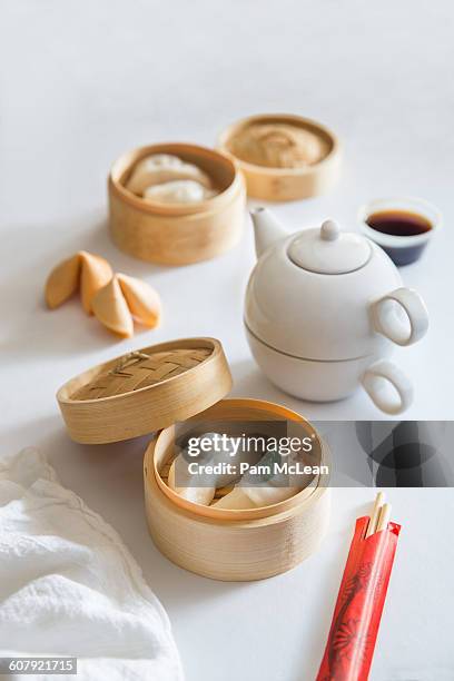chinese dim sum steamed dumplings and tea pot - dim sum meal stock pictures, royalty-free photos & images