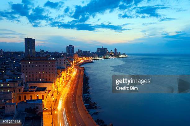 havana, cuba, malecon at dusk - havana cuba stock pictures, royalty-free photos & images