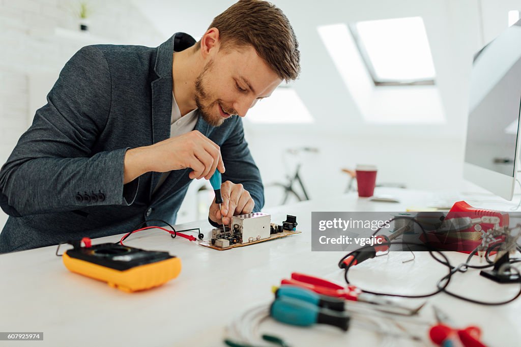 Man Testing Circuit Board In His Office High-Res Stock Photo - Getty Images
