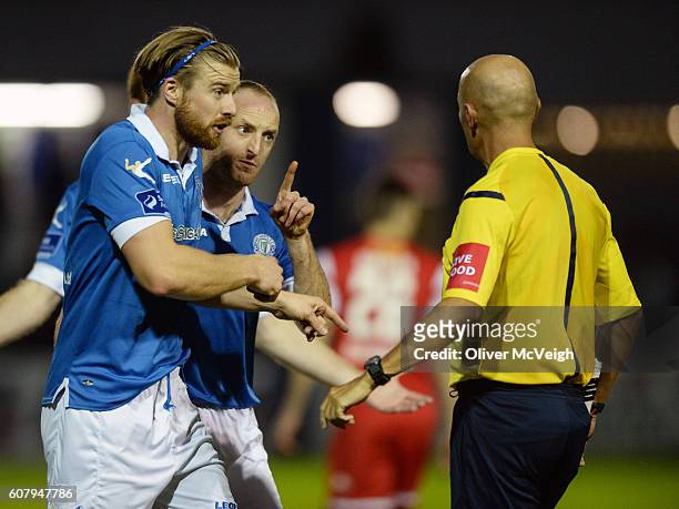Donegal , Ireland - 19 September 2016; Keith Cowan and Michael Funston of Finn Harps have words with Referee Paul Tuite during the SSE Airtricity...