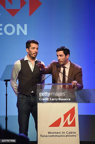 The Property Brothers Jonathan Scott and Drew Scott speak onstage during the WICT Leadership Conference Touchstones Luncheon at Marriot Marquis on...