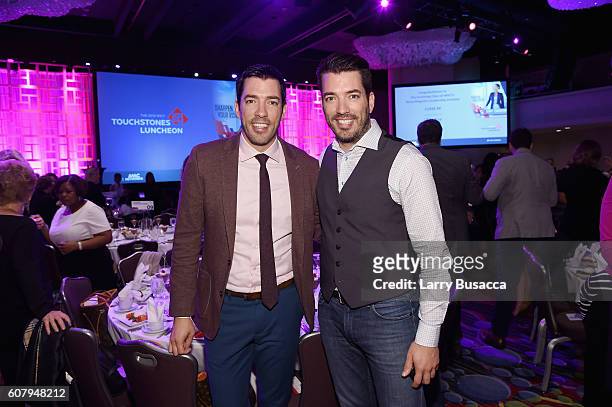 The Property Brothers Jonathan Scott and Drew Scott pose for a photo during the WICT Leadership Conference Touchstones Luncheon at Marriot Marquis on...