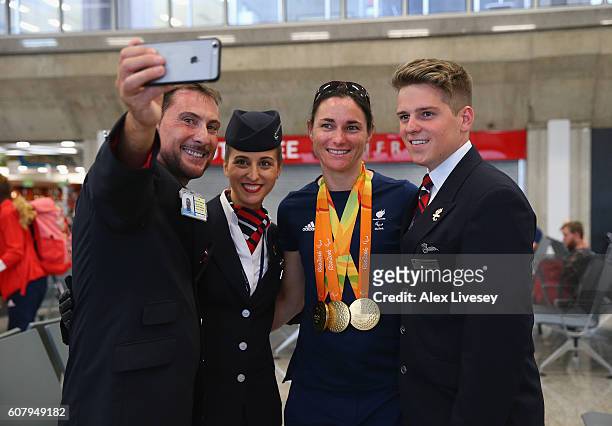 Sarah Storey of the Paralympics GB Team has a selfie taken with members of the British Airways crew as they prepare to fly back from Galeao Airport...