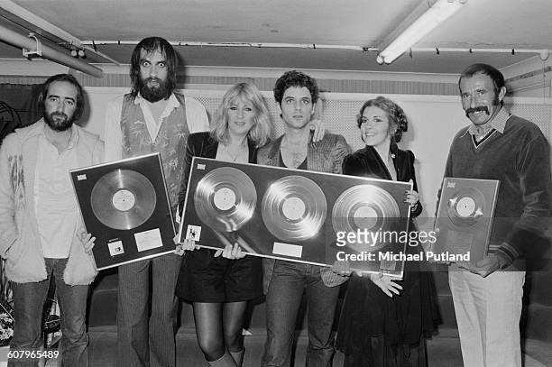 Anglo-American rock group Fleetwood Mac with awards for British sales of their albums 'Rumours' and Tusk', Wembley Arena, London, June 1980. The band...