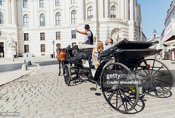 austria, vienna, tourists on sightseeing tour in a fiaker - horse carriage bildbanksfoton och bilder