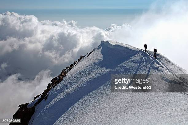 switzerland, pennine alps, saas-grund, weissmies, mountaineers - winter sport stock-fotos und bilder