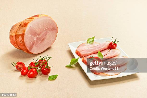 slices of cooked ham on plate - ham stock pictures, royalty-free photos & images