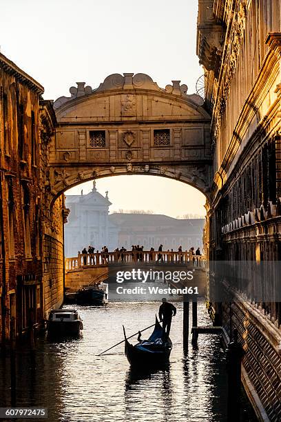 italy, veneto, venice, bridge of sighs with gondolier - venice stock pictures, royalty-free photos & images