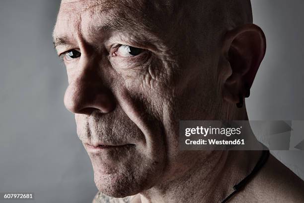 portrait of sceptical looking man with bald - bald man foto e immagini stock