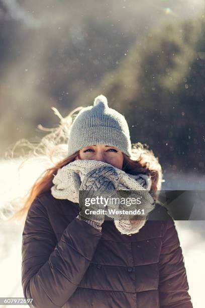 portrait of woman in nature wearing warm clothing - winter scarf stock pictures, royalty-free photos & images
