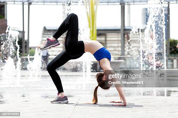 sportive young woman doing wheel pose in the city - 7894 stock pictures, royalty-free photos & images