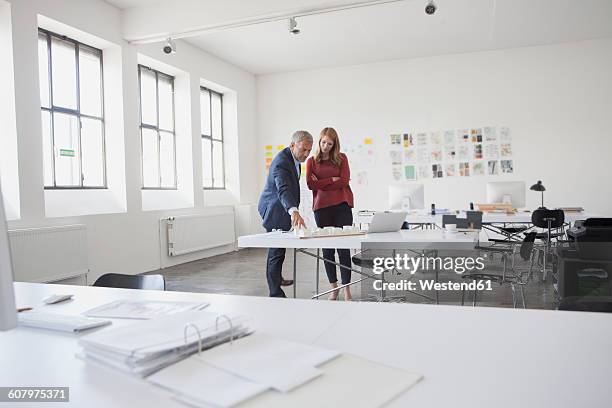 two architects discussing project in office - folder mockup stock pictures, royalty-free photos & images