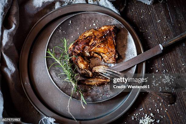 baked rabbit legs on plate, thyme, rosemary and salt - hare viltkött bildbanksfoton och bilder
