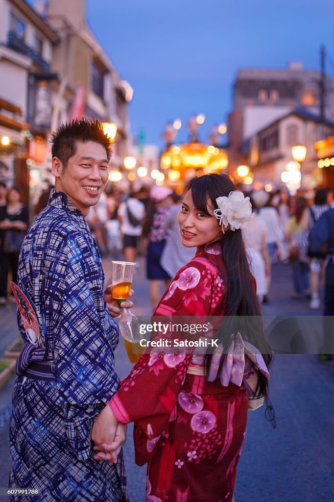 Japanese Yukata couple walking on festive street