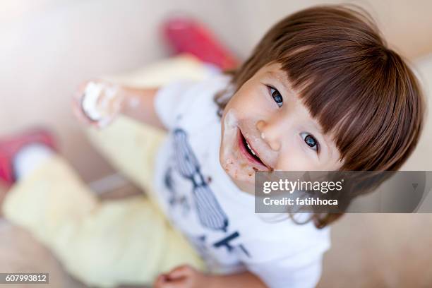 happy boy and ice cream - chocolate face stock pictures, royalty-free photos & images