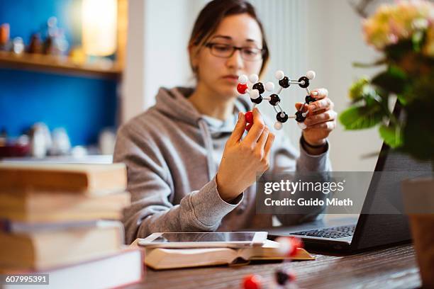 student learning at home. - physics stock pictures, royalty-free photos & images