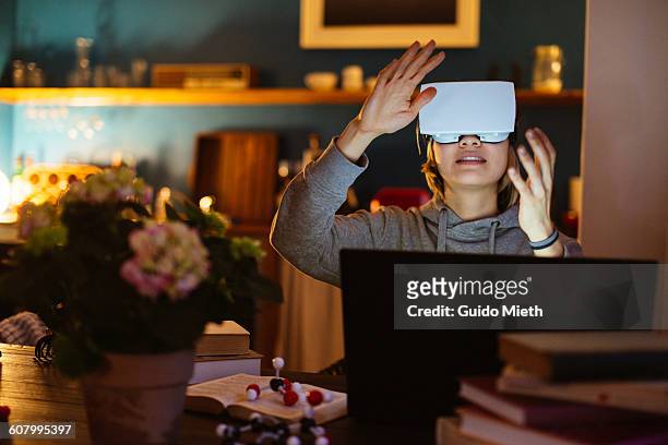 woman enjoying virtual reality headset. - virtualitytrend stockfoto's en -beelden